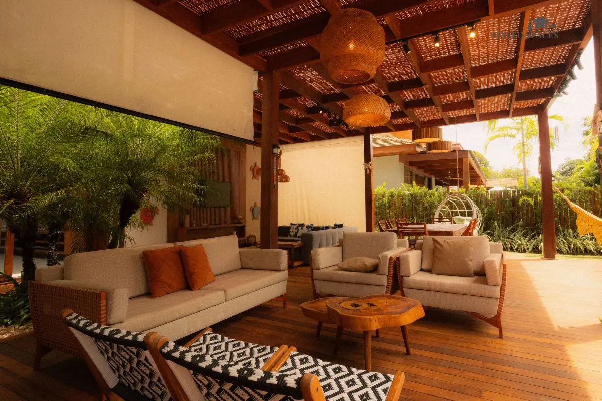 Pergola providing shade over a patio lounge area