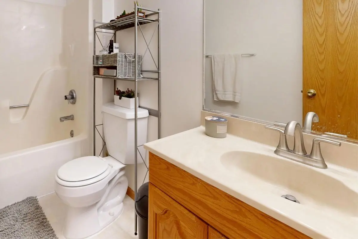 Vertical storage shelving in a small bathroom