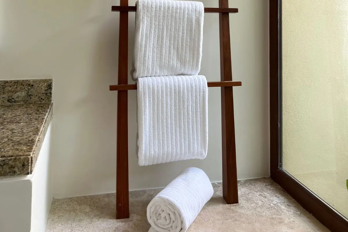 Crisp white rolled towels for a spa-like bathroom look