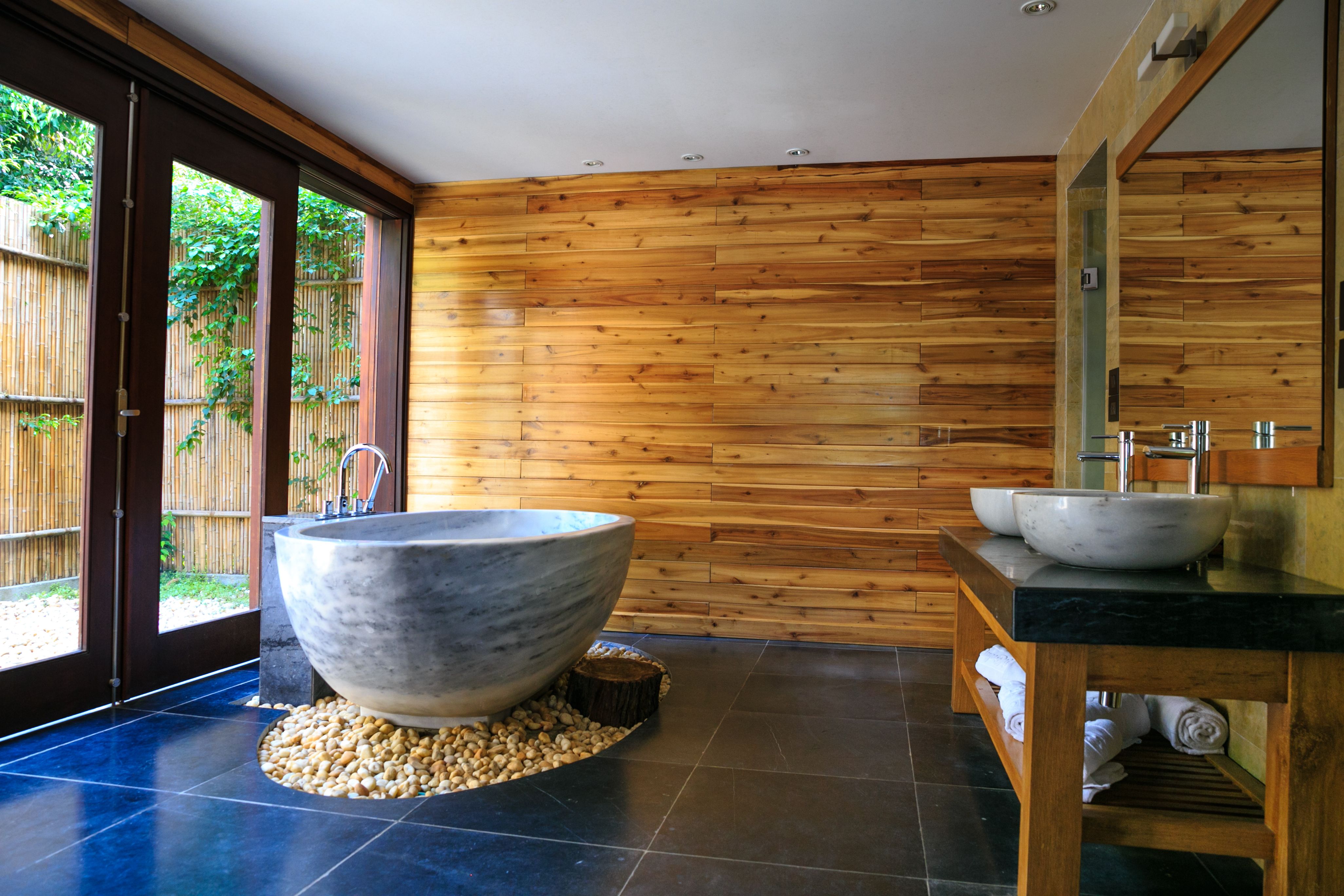 Spa-like bathroom with natural stone tub