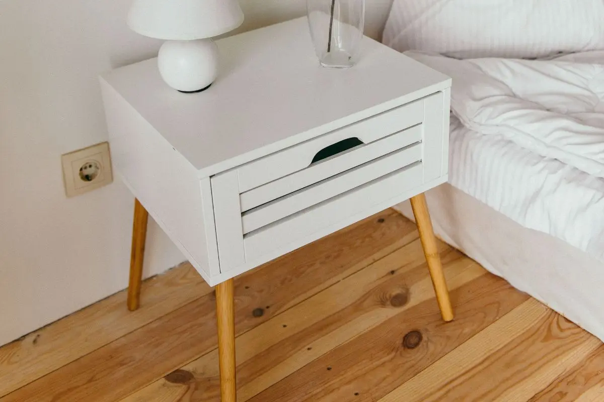 Clutter-free nightstand with a lamp and a single vase