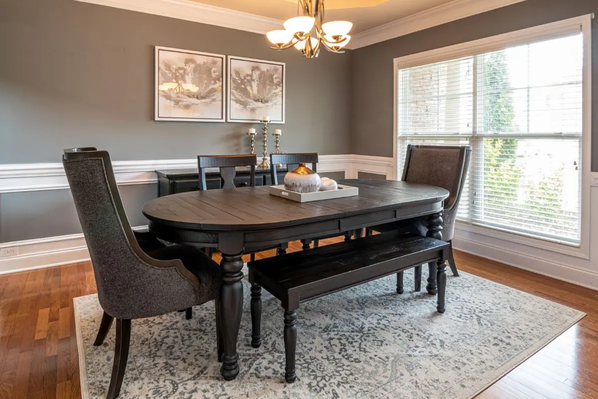 Dining table paired with a bench and mismatched chairs
